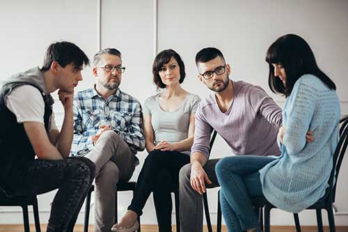 group engaged in cognitive-behavioral therapy