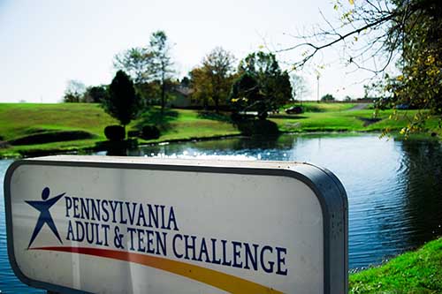 sign that encourages you to learn about Pennsylvania Adult and Teen Challenge