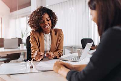 two women discussing the rehab admissions process