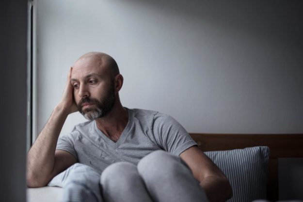What Are the Signs of Heroin Addiction_ man sitting down