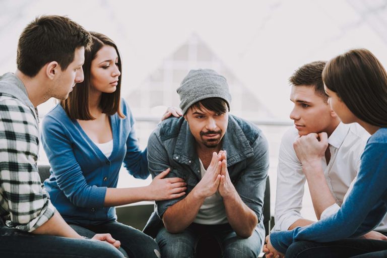 5008741 Circle of trust. Group of people sitting in circle a group of people try to convince their friend to find an addiction treatment center