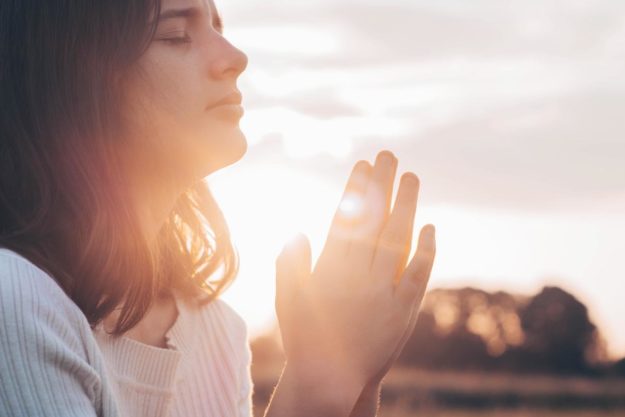 Does Faith Based Addiction Treatment Actually Work_ a woman prays about the benefits of faith-based addiction treatment