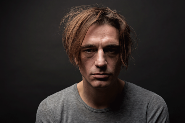 Heroin-and-the-Brain A man thinking about heroin and the brain