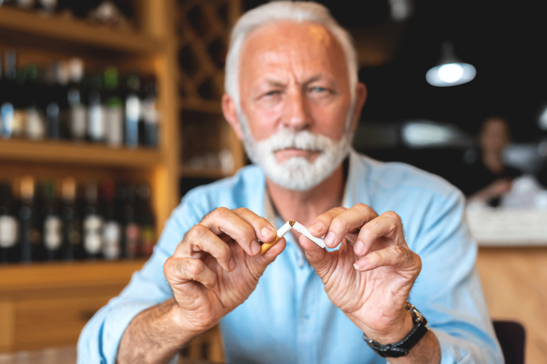 Treating-Nicotine-Dependence Older man trying to break his nicotine dependence