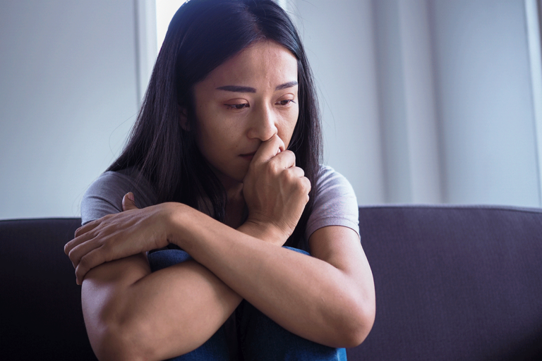 How-Fentanyl-Gets-Mixed-With-Cocaine Woman thinking about her fentanyl and cocaine use