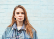A young woman contemplates the stigma of addiction