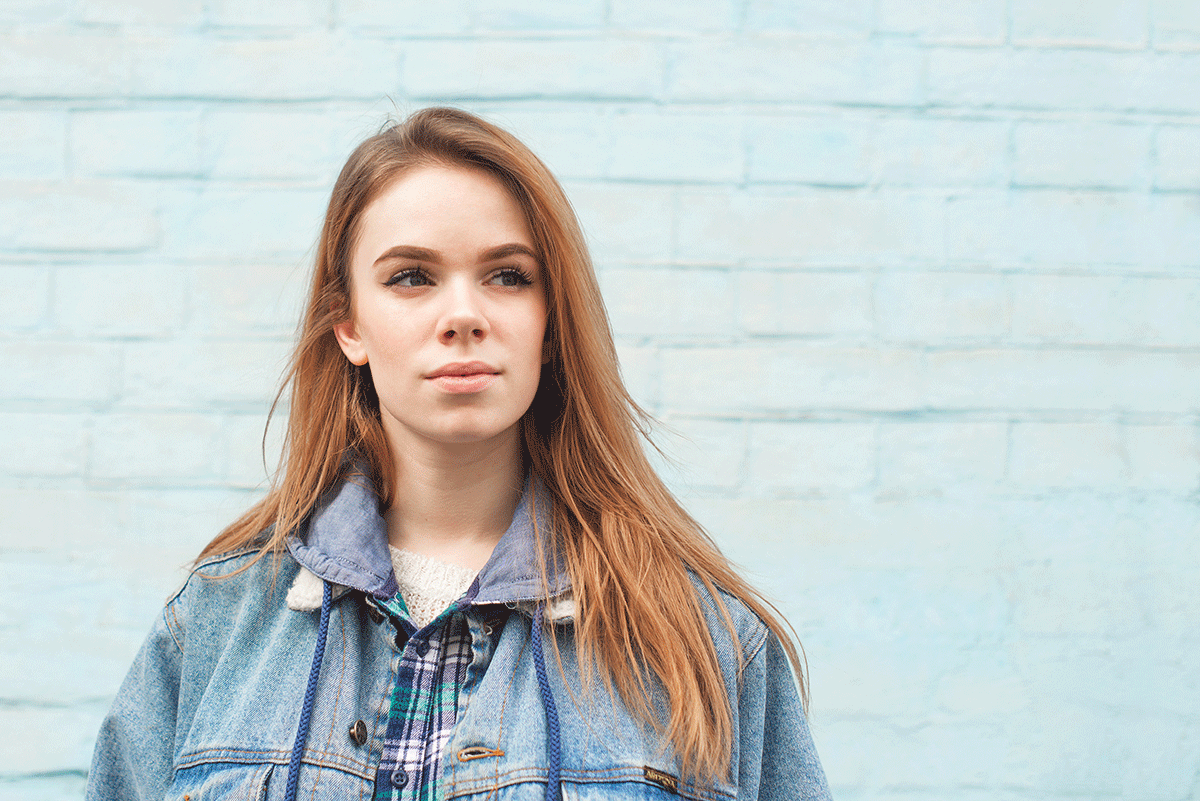 Understanding-and-Overcoming-the-Stigma-of-Addiction A young woman contemplates the stigma of addiction